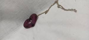 lot 35125 image: Purple heart-shaped pendant on silver chain