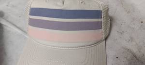 lot 35134 image: Bundle of 12 cream colored hats with pink blue and purple stripes on the front
