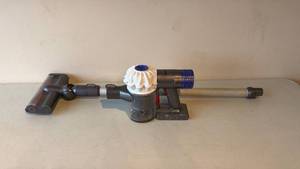 lot 16 image: Dyson V6 Cordless Vacuum Cleaner with Accessories used  - Retail $0