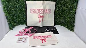 lot 153 image: Bridesmaid Gift Set with Canvas Tote, Cosmetic Bag, Headscarf, and Bracelet - Retail $0