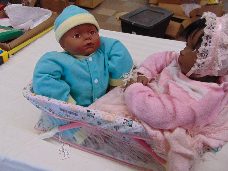 lot 2308 image: Dolls in Basket