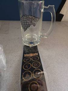lot 2708 image: Game of Thrones Beer Mug for Adults - Bundle with 16 Oz House Lannister Beer Stein Drinking Glass Plus Bookmark House Lannister Collectible Heavy Glass Mugs with Handles - Retail $12