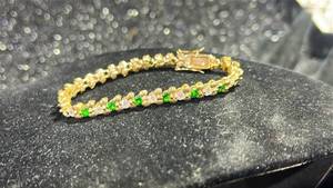 lot 67 image: Gold Tone Bracelet with Green and Clear Stones
