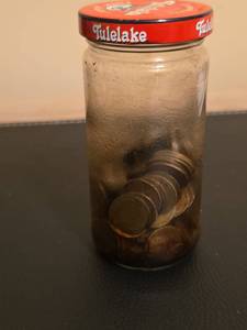 lot 188 image: Jar of oil coated 1943 -1944 steel pennies