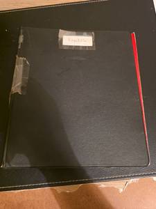 lot 212 image: Notebook with empty coin pages