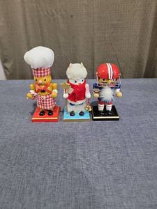 lot 692 image: Three Decorative Figurines Chef Angel Football Player