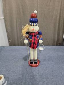 lot 726 image: Wooden Nutcracker Figurine Red Blue Plaid Scarf Straw Hat