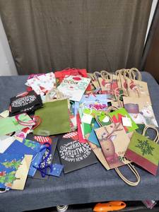 lot 735 image: Lot of Holiday Gift Bags and Gift Wrap Assorted Designs