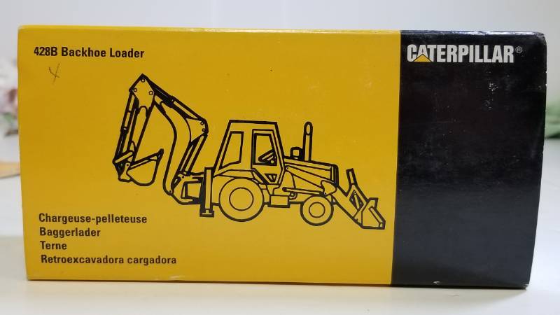lot 1652 image: CAT 42s8B Backhoe Loader  appears to be 150 scale  NIB