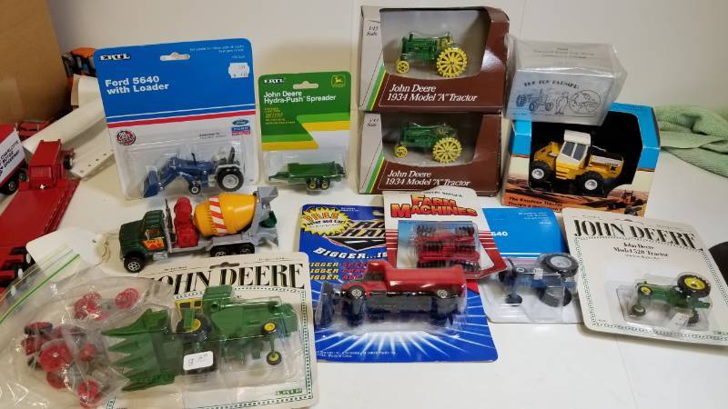 lot 1661 image: 1 lot 164 Farm TractorsDiscSpreaderdump truck and more  164 scale on most  see pix  most NIB
