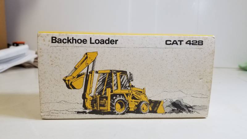 lot 1662 image: CAT 428 Backhoe Loader  Appears to be 150 scale  #2851  NIB