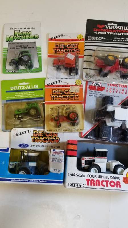 lot 1679 image: 1 lot  ERTL 8 each Tractors  164 scale  See Pix  NIB
