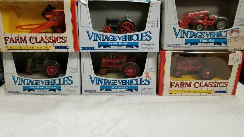lot 1757 image: 6 items 143 5 Tractors1 Farmall1 English Fordson1 Ford 8N wloader1 Massey Harris 1 Farmall 300 1 AC Round BailerNIB