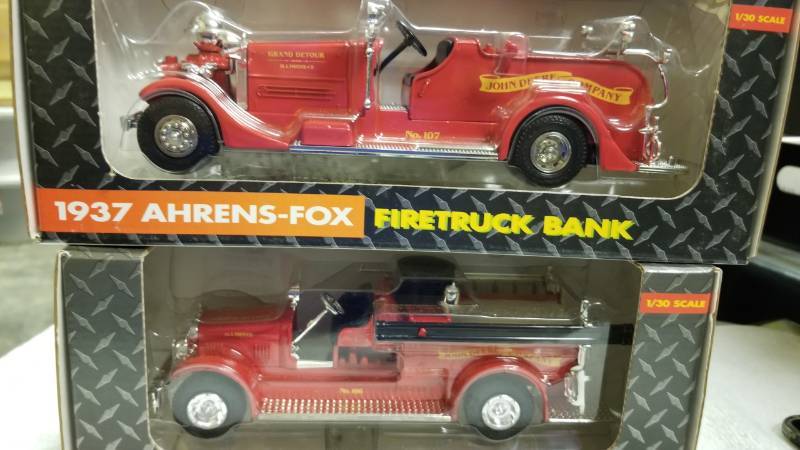 lot 1782 image: 2 each ERTL Bank Fire Trucks1937 Ahrens-Fox Firetruck, #5773 1926 Seagrave Firetruck, #5710130 scaleNIB