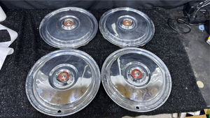 lot 23 image: Hubcaps with Shield Crest Center Emblem Set of 4