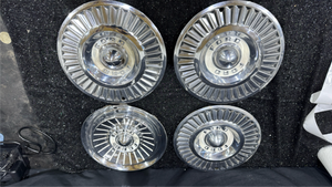 lot 24 image: Ford Hubcaps 4-Piece Set