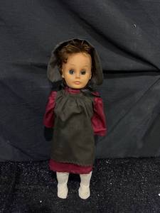 lot 49 image: Doll with Black Bonnet Red Dress and White Socks