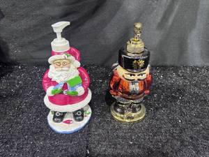 lot 111 image: Holiday Figurine Soap Dispensers Santa and Nutcracker 2-Piece Lot