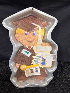 lot 188 image: Wilton Proud Graduate Gingerbread Boy Cake Pan