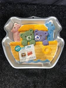 lot 199 image: Lionels Pig Cake Pan with Decorative Fabric Pieces and Instruction Card