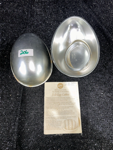 lot 206 image: Wilton 3-D Egg Cake Pan Set with Instructions