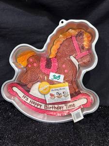 lot 303 image: Wilton Rocking Horse Cake Pan Its Happy Birthday Time