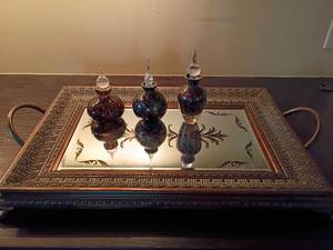 lot 1015 image: Mirrored Tray with Perfume Bottles.  Tallest bottle is 7in. tall with a chip, see pictures.  Tray is 25 x 15