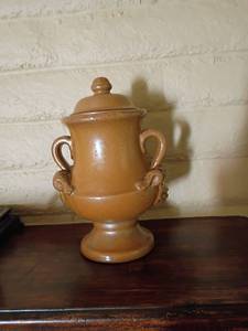 lot 1016 image: 11in tall Pottery with double handles and lid.