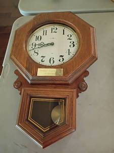 lot 1037 image: Howard Miller USA Wall Clock with Pendulum.  24 x 15.