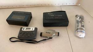 lot 1107 image: Portable Audio Devices Realistic Stereo-Mate, Memorex VOX, Sony Walkman, Vivitar, Philips Earbuds