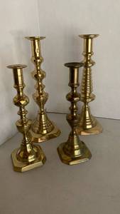 lot 1117 image: Brass Candlesticks Mixed Heights 12 inches tall and smaller