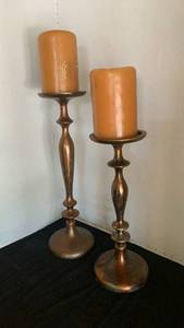 lot 1146 image: Pair of oxidized Copper Candlesticks with Orange Pillar Candles 18 inches tall and smaller