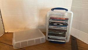 lot 1183 image: Lot of Music CDs in Clear Storage Container with Blue Handle