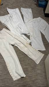 lot 1416 image: Lot of 5 White Cream Pants Medium. One has stain on left leg.