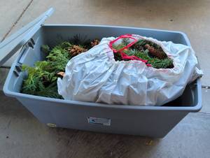 lot 2048 image: Sterilite 45 Gallon Storage Container with Christmas garlands