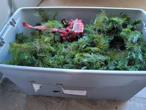 lot 2049 image: Sterilite 45 Gallon Storage Container with Christmas garlands