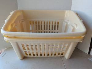 lot 2106 image: Rubbermaid Laundry Baskets with Handles Cream