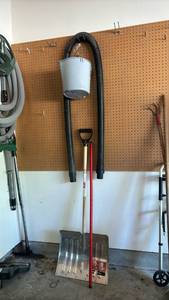 lot 2503 image: Shop Vacuum hose, a bucket and a snow shovel