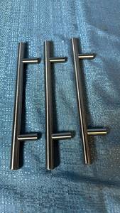 lot 2055 image: Three Chrome Cabinet or Drawer Pull Handles.