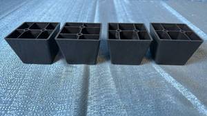 lot 2115 image: Lot of 4 Black Plastic Furniture Legs.
