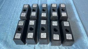 lot 2119 image: Lot of 10 Black Rectangular Plastic Furniture Legs.