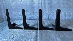 lot 2132 image: Lot of 4 Black Metal Corner Mount Furniture Legs.