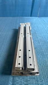 lot 8017 image: 5 Piece (Drawer) Set of Cream Colored Roller Style Drawer Slides