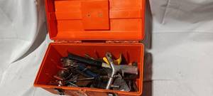lot 34814 image: Tool box full of a variety of tools, plumbers tape, hammer, pliers, pry bar, metal putty scrapers, and Phillips screwdrivers