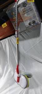 lot 34867 image: Cordless dual-spin electric mop and floor cleaner with an aluminum telescopic handle and dual rotating cleaning pads.