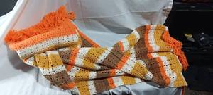 lot 34905 image: Orange gold and cream crochet scarf