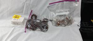 lot 34919 image: Assortment of napkin holders, flowers, and brown beaded napkin holders