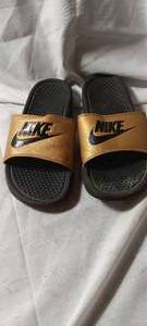 lot 34931 image: Nike gold and black slides size 10