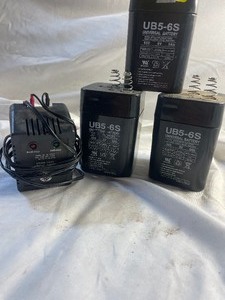 lot 34668 image: 3 UB56S 6V 58H Universal Batteries & Charger.