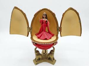 lot 3880 image: Avon Barbie Countess Of Rubie 2001 Red Resin Egg Brunette Musical Display